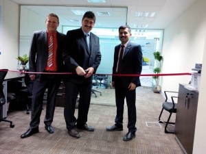 Photo: From left: Robin Steinsdorfer, Gottlieb Hupfer and John Thomas Visakh prepare to cut the ribbon opening the new EnviroChemie FZE office in Dubai.