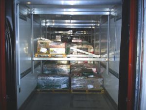 Cold chain truck shipment: interior of temperature-controlled lorry.